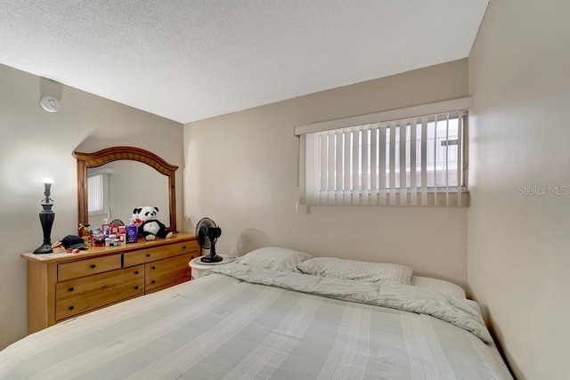 2763 Woodgate Ln Unit 211, Sarasota, FL 34231 - bedroom featuring a textured ceiling