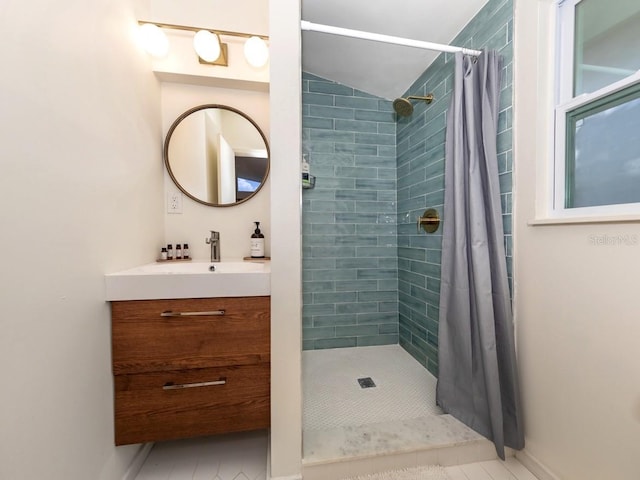 2933 Michigan St, Sarasota, FL 34237 - bathroom with vanity, a tile shower, and tile patterned floors