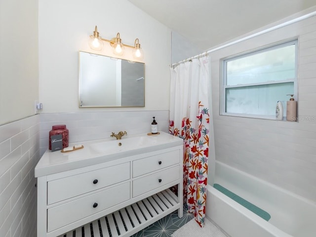 2933 Michigan St, Sarasota, FL 34237 - full bathroom featuring tile walls, vanity, shower / bath combo, and tile patterned flooring