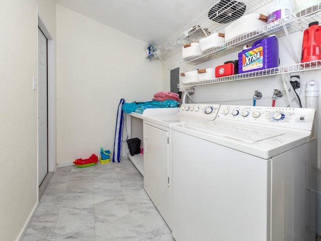 2933 Michigan St, Sarasota, FL 34237 - laundry room featuring light marble finish flooring and washer and clothes dryer