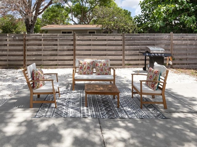 2933 Michigan St, Sarasota, FL 34237 - fenced backyard featuring a patio area and outdoor lounge area