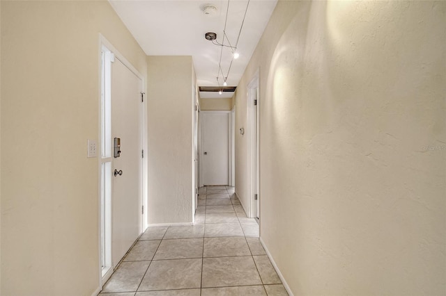 3276 Westford Ln, Sarasota, FL 34231 - hall with light tile patterned flooring and a textured wall