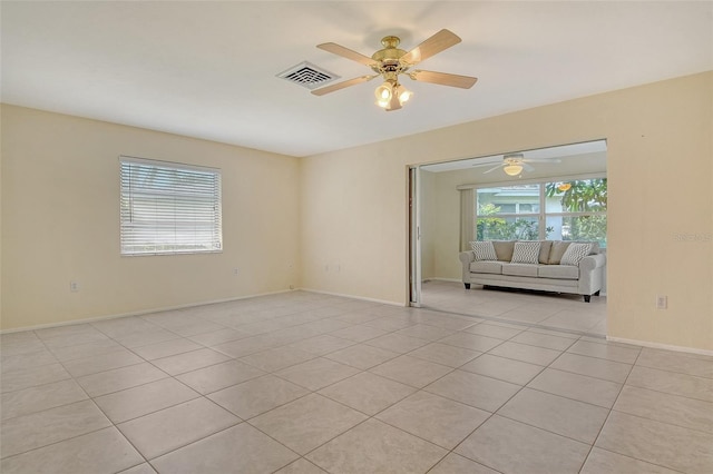 3276 Westford Ln, Sarasota, FL 34231 - spare room with ceiling fan and light tile patterned floors