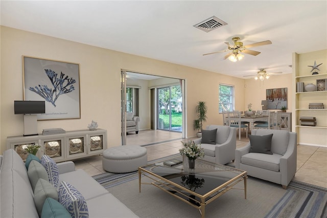 3276 Westford Ln, Sarasota, FL 34231 - living area with a ceiling fan and tile patterned floors