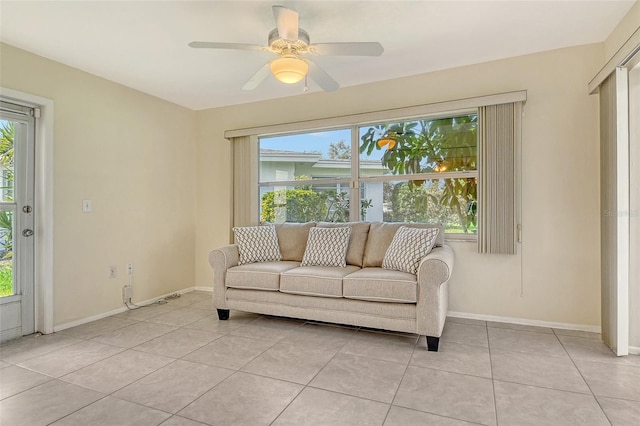 3276 Westford Ln, Sarasota, FL 34231 - living room featuring light tile patterned floors and a ceiling fan