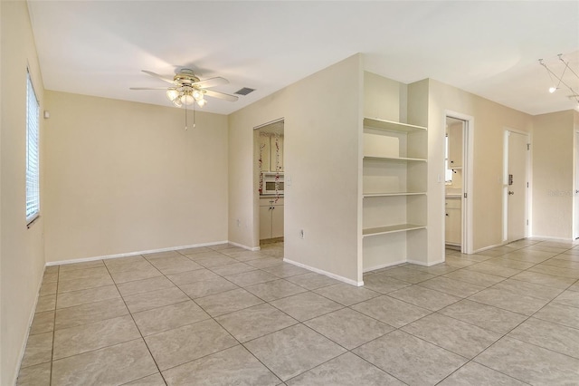 3276 Westford Ln, Sarasota, FL 34231 - spare room featuring ceiling fan and light tile patterned floors