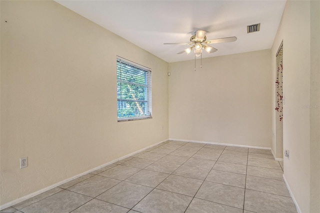 3276 Westford Ln, Sarasota, FL 34231 - spare room featuring a ceiling fan and light tile patterned floors