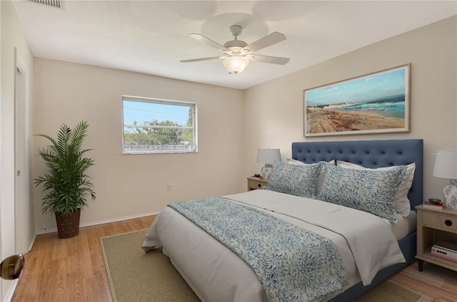 3276 Westford Ln, Sarasota, FL 34231 - bedroom with wood finished floors and ceiling fan