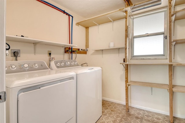 3276 Westford Ln, Sarasota, FL 34231 - laundry room with washer and dryer and baseboards