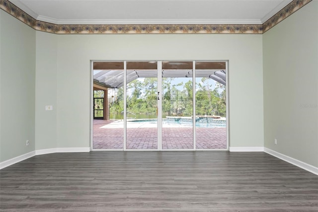 8312 Misty Lake Cir, Sarasota, FL 34241 - unfurnished room with wood finished floors and ornamental molding