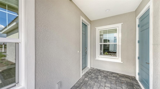 2321 Blue Mahoe Ln, Sarasota, FL 34240 - entrance to property featuring stucco siding