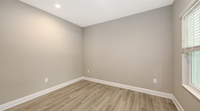 2321 Blue Mahoe Ln, Sarasota, FL 34240 - spare room featuring baseboards, light wood finished floors, and recessed lighting