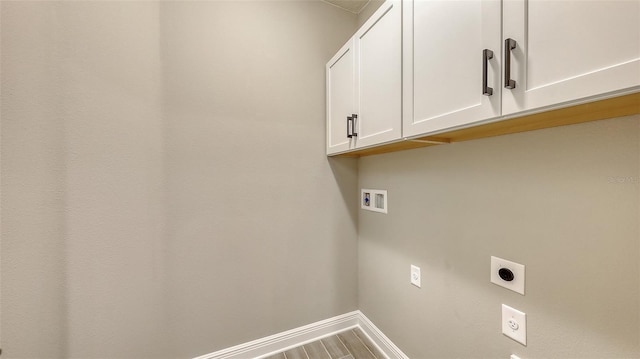 2321 Blue Mahoe Ln, Sarasota, FL 34240 - laundry room featuring cabinet space, hookup for an electric dryer, hookup for a washing machine, and baseboards
