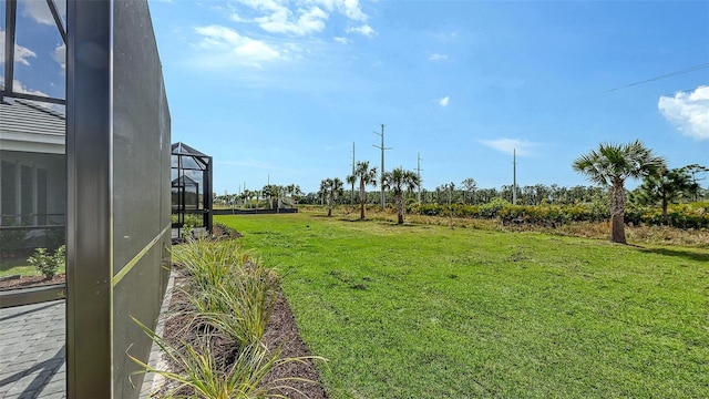 2321 Blue Mahoe Ln, Sarasota, FL 34240 - view of grassy yard featuring glass enclosure