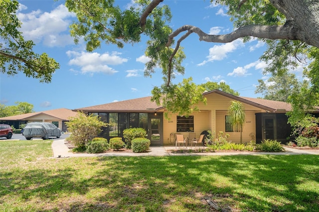 4165 66th Street Cir W Unit H, Bradenton, FL 34209 - ranch-style house with a front lawn and a patio area