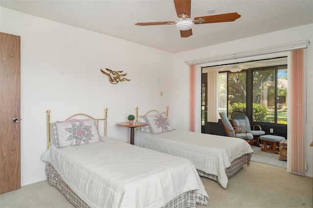 4165 66th Street Cir W Unit H, Bradenton, FL 34209 - bedroom with carpet floors, access to exterior, and ceiling fan