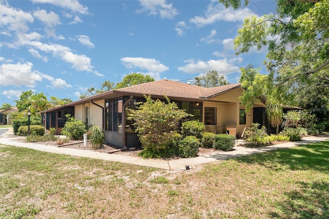 4165 66th Street Cir W Unit H, Bradenton, FL 34209 - view of front of house featuring a sunroom and a front yard