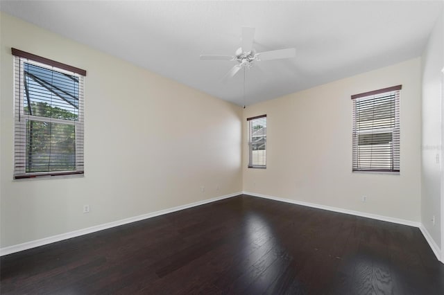 5410 Matthew Ct, Sarasota, FL 34231 - unfurnished room featuring dark wood finished floors and a ceiling fan