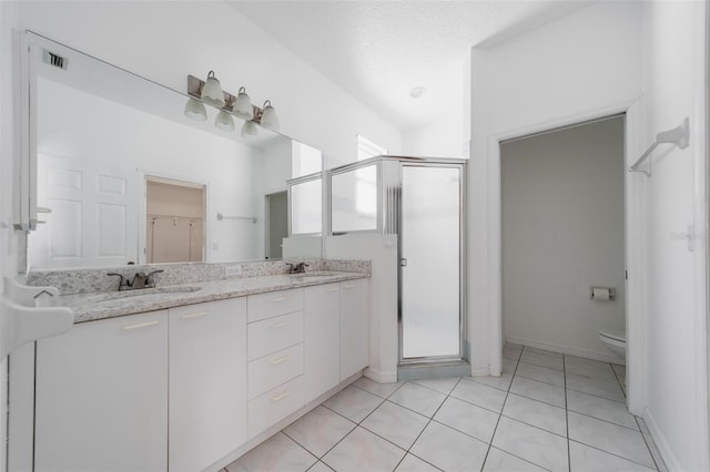 5410 Matthew Ct, Sarasota, FL 34231 - bathroom featuring a shower stall, double vanity, and tile patterned floors