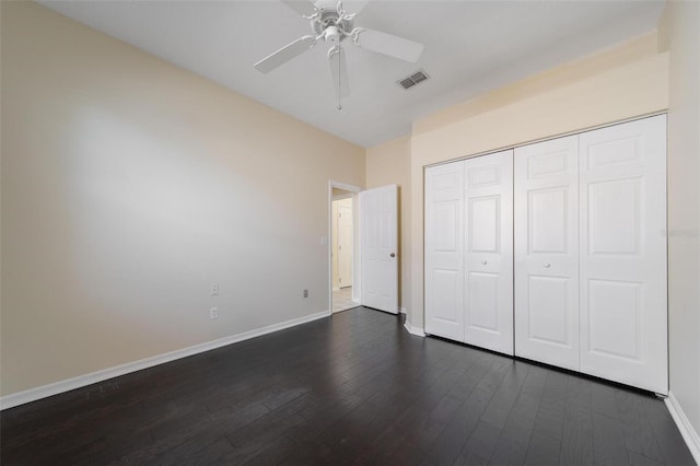 5410 Matthew Ct, Sarasota, FL 34231 - unfurnished bedroom with dark wood-style floors, a closet, and ceiling fan