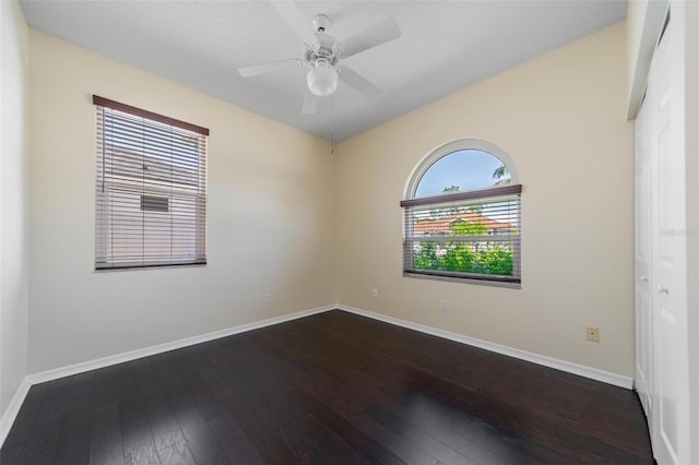 5410 Matthew Ct, Sarasota, FL 34231 - empty room featuring dark wood-style flooring and ceiling fan