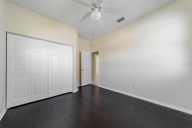 5410 Matthew Ct, Sarasota, FL 34231 - unfurnished bedroom with dark wood-style floors, a closet, and a ceiling fan
