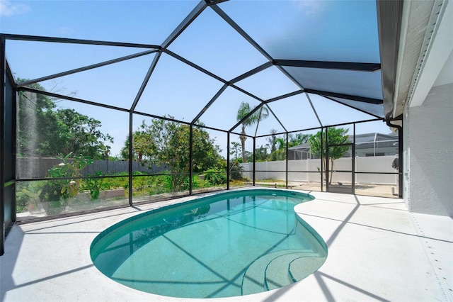 5410 Matthew Ct, Sarasota, FL 34231 - view of swimming pool featuring a fenced backyard, a patio area, and a lanai