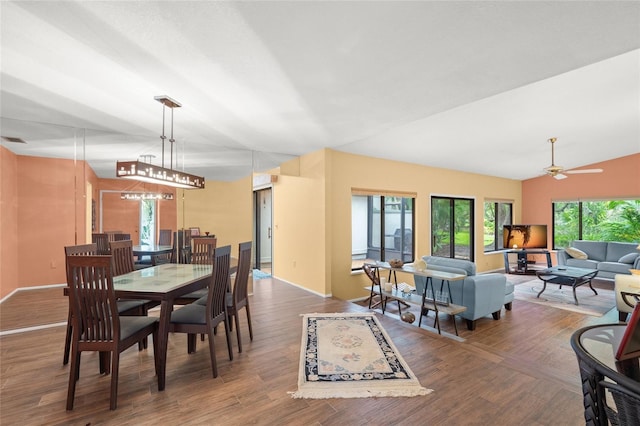 4637 Willow Wood Cir Unit 44, Sarasota, FL 34241 - dining room with wood finished floors, vaulted ceiling, and ceiling fan