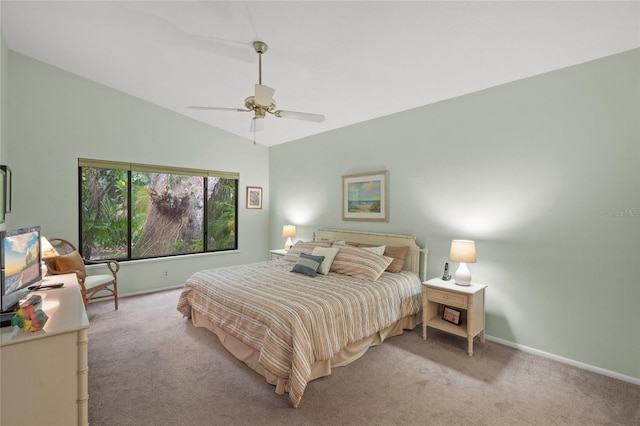 4637 Willow Wood Cir Unit 44, Sarasota, FL 34241 - bedroom with light carpet, lofted ceiling, and a ceiling fan