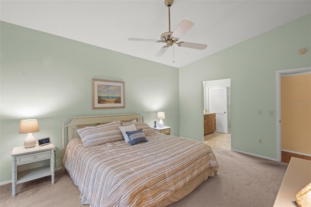 4637 Willow Wood Cir Unit 44, Sarasota, FL 34241 - bedroom featuring light colored carpet, vaulted ceiling, a ceiling fan, and ensuite bath