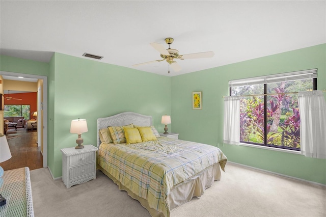 4637 Willow Wood Cir Unit 44, Sarasota, FL 34241 - carpeted bedroom with baseboards and a ceiling fan
