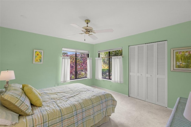 4637 Willow Wood Cir Unit 44, Sarasota, FL 34241 - bedroom with carpet flooring, a closet, and ceiling fan