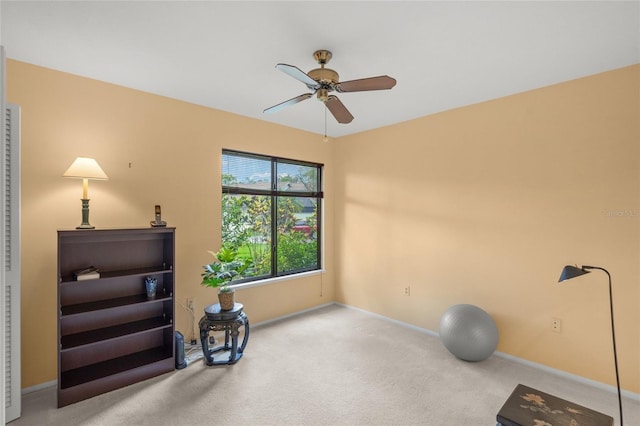 4637 Willow Wood Cir Unit 44, Sarasota, FL 34241 - exercise room featuring a ceiling fan and carpet floors