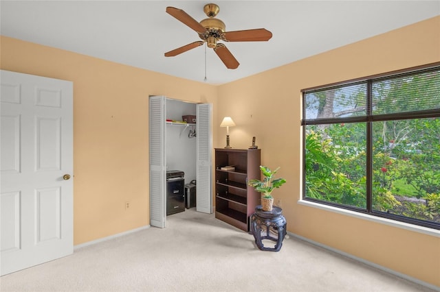 4637 Willow Wood Cir Unit 44, Sarasota, FL 34241 - carpeted bedroom featuring a closet and a ceiling fan
