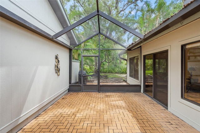 4637 Willow Wood Cir Unit 44, Sarasota, FL 34241 - unfurnished sunroom with lofted ceiling