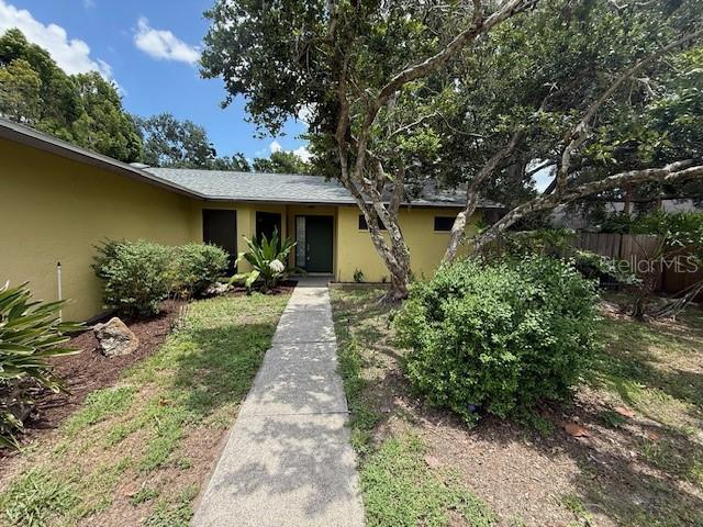 5032 81st Avenue Terrace E, Sarasota, FL 34243 - view of exterior entry featuring stucco siding