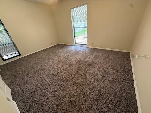 5032 81st Avenue Terrace E, Sarasota, FL 34243 - empty room featuring carpet floors