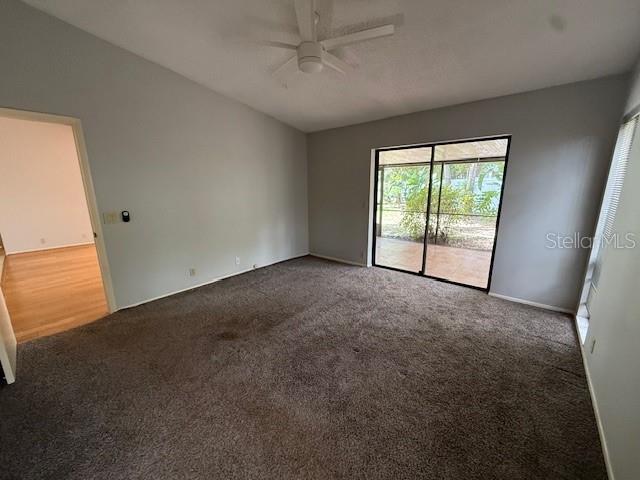 5032 81st Avenue Terrace E, Sarasota, FL 34243 - carpeted spare room with ceiling fan