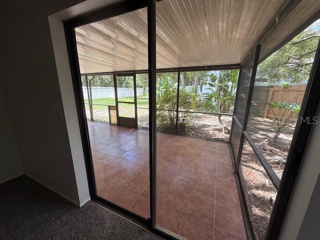 5032 81st Avenue Terrace E, Sarasota, FL 34243 - unfurnished sunroom featuring healthy amount of natural light