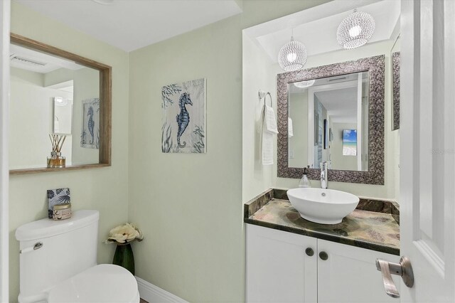 1500 Sunset Rd Unit B4, Tarpon Springs, FL 34689 - bathroom featuring toilet and vanity