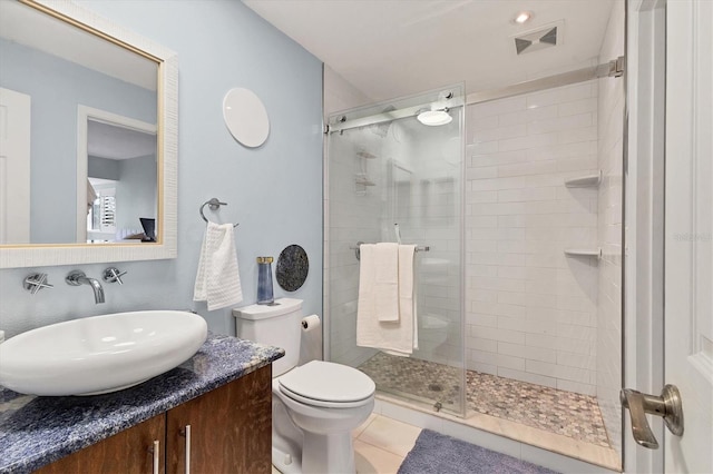 1500 Sunset Rd Unit B4, Tarpon Springs, FL 34689 - bathroom featuring a shower stall, vanity, and tile patterned floors