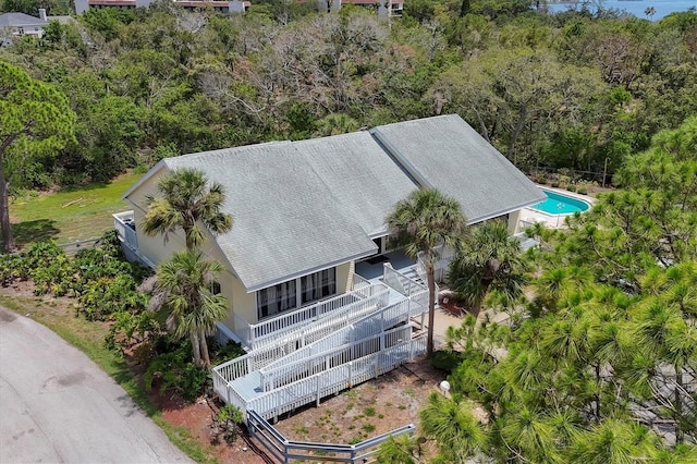 1500 Sunset Rd Unit B4, Tarpon Springs, FL 34689 - view of subject property featuring a forest and a pool