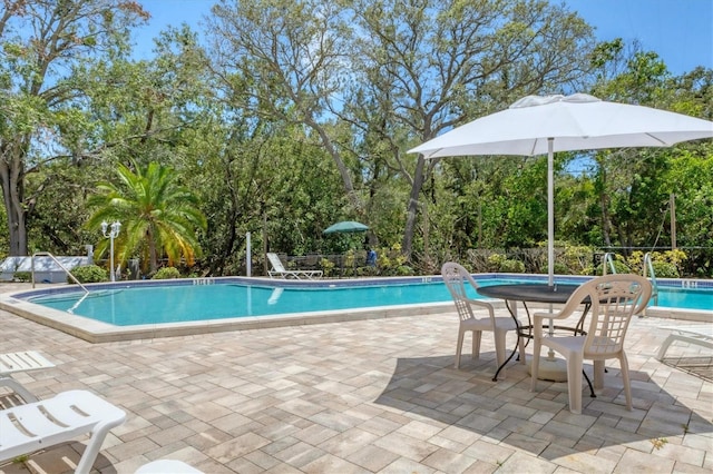 1500 Sunset Rd Unit B4, Tarpon Springs, FL 34689 - community pool featuring view of scattered trees and a patio area
