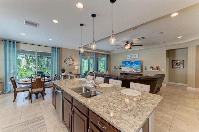 5307 65th Ter E, Ellenton, FL 34222 - kitchen featuring a sink, stainless steel dishwasher, open floor plan, pendant lighting, and recessed lighting