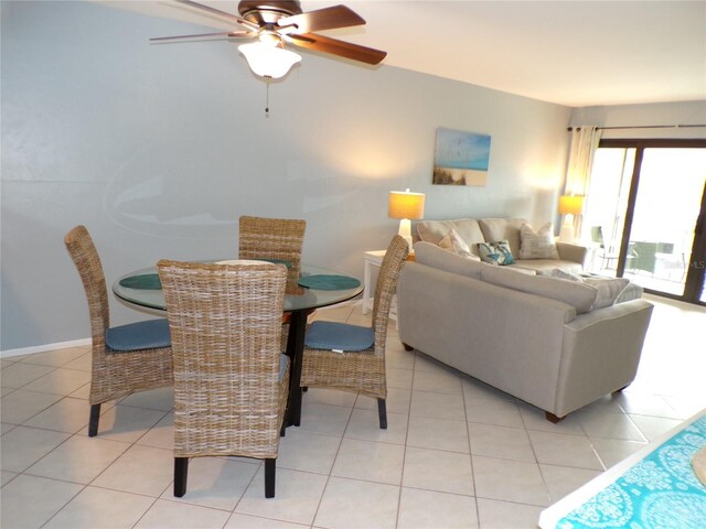 1801 Gulf Dr N Unit 207, Bradenton Beach, FL 34217 - dining room with a ceiling fan and light tile patterned floors