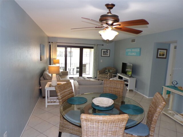 1801 Gulf Dr N Unit 207, Bradenton Beach, FL 34217 - dining area with light tile patterned flooring and ceiling fan