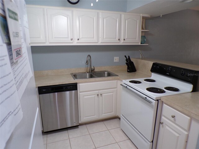 1801 Gulf Dr N Unit 207, Bradenton Beach, FL 34217 - kitchen with dishwasher, electric range, white cabinetry, and light countertops