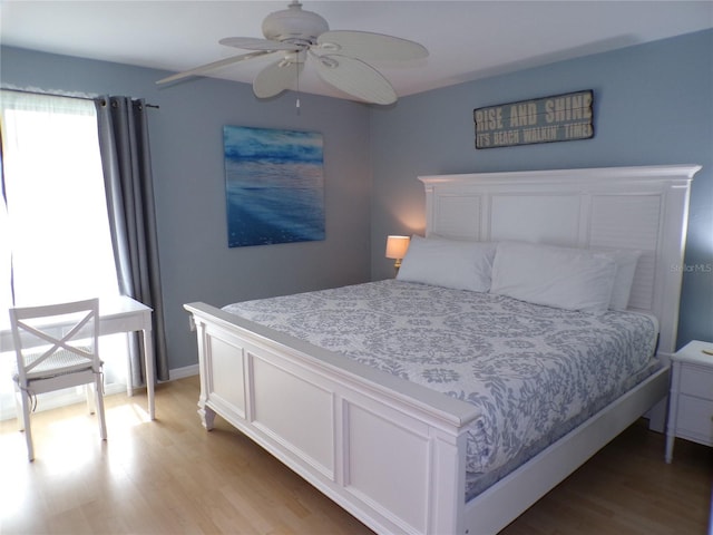 1801 Gulf Dr N Unit 207, Bradenton Beach, FL 34217 - bedroom with light wood-type flooring and ceiling fan