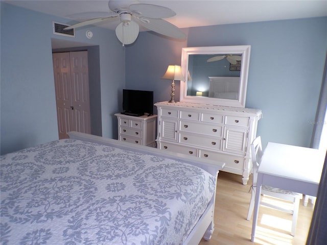 1801 Gulf Dr N Unit 207, Bradenton Beach, FL 34217 - bedroom with light wood-type flooring and a ceiling fan
