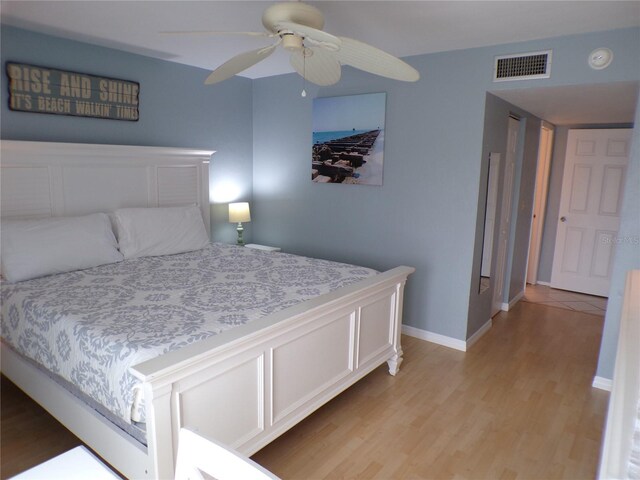 1801 Gulf Dr N Unit 207, Bradenton Beach, FL 34217 - bedroom featuring light wood finished floors and a ceiling fan